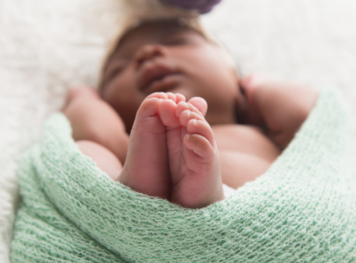 newborn multiracial baby sleeping