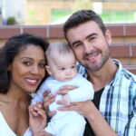 adoptive parents with new baby