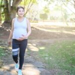 pregnant woman on walk in park