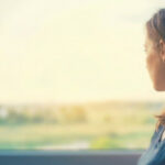 birthmother looking out of a window