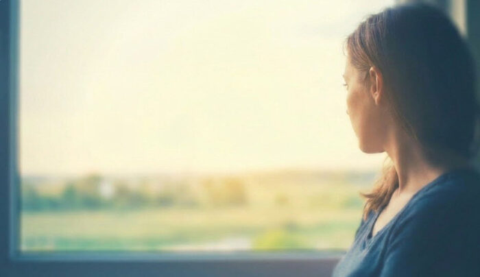 birthmother looking out of a window