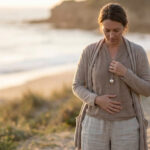 birthmother walking along a beach